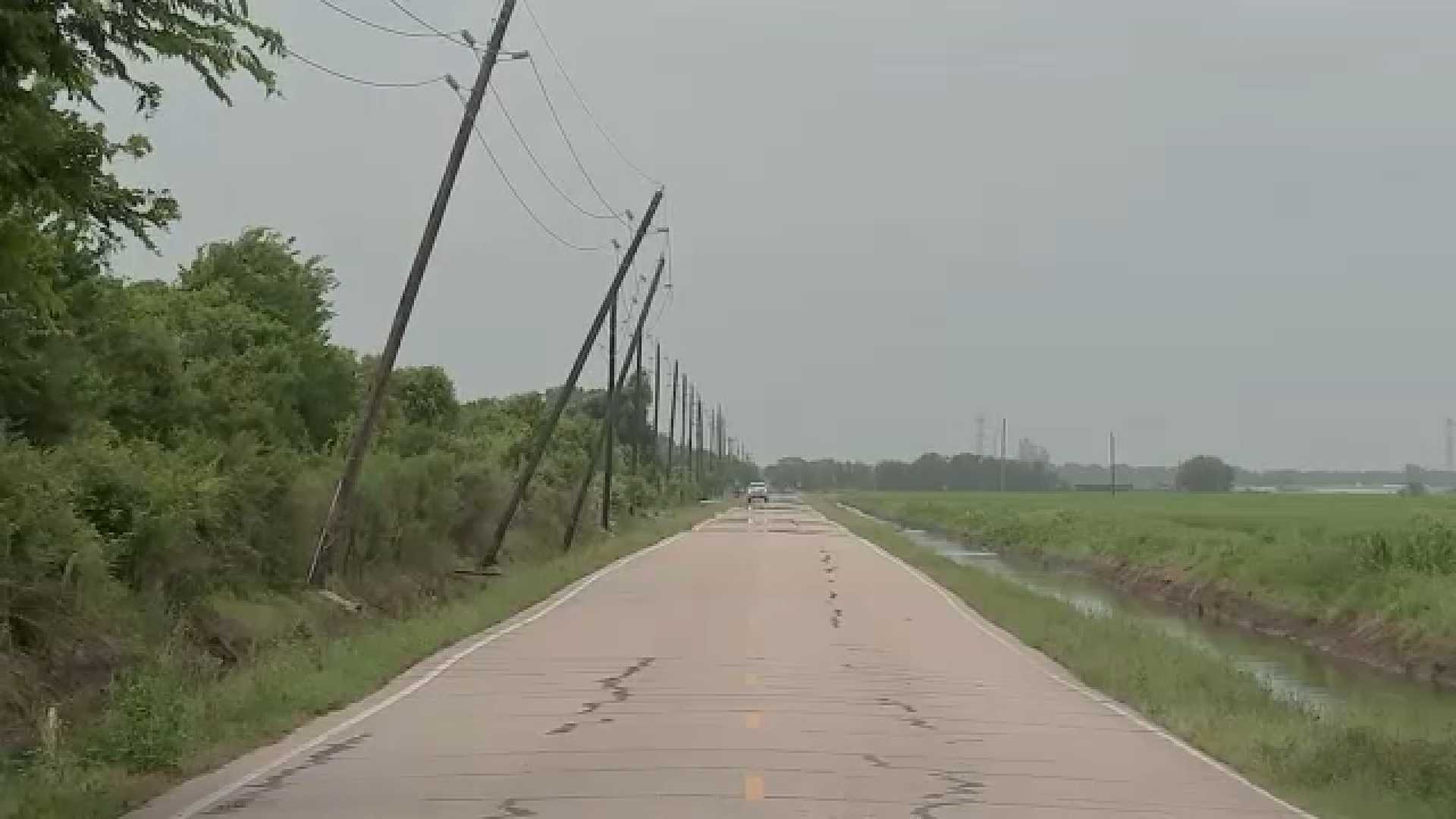 Images show power poles leaning over Brazoria County road, neighbors say it's not the first time