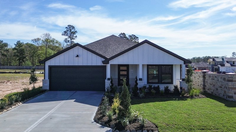 Front exterior of an Alta Homes residence at 10727 Crockett Meadows Boulevard in Conroe.
